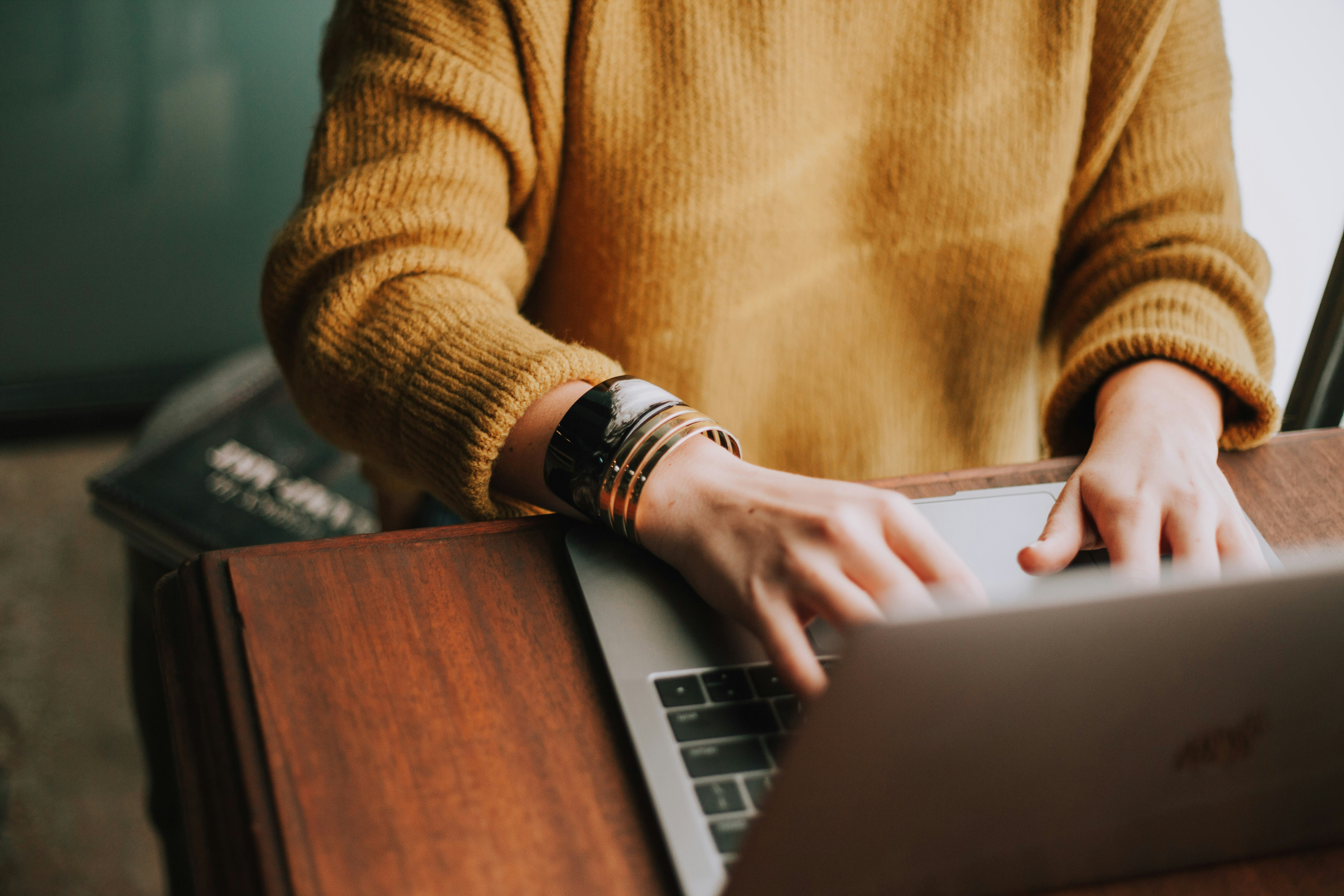 Person Using Laptop - Omnichannel eCommerce